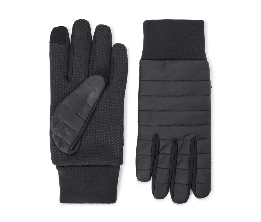 Ein Paar schwarze Handschuhe. Der linke Handschuh zeigt eine gepunktete Grifffläche und einen gesteppten Daumen. Der rechte Handschuh zeigt einen gesteppten Handrücken. Beide haben gerippte Bündchen.