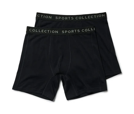 Zwei schwarze Slipboxer mit Merinowolle liegen übereinander.