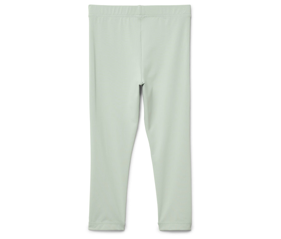 Hellgrüne Leggings auf einem weißen Hintergrund.