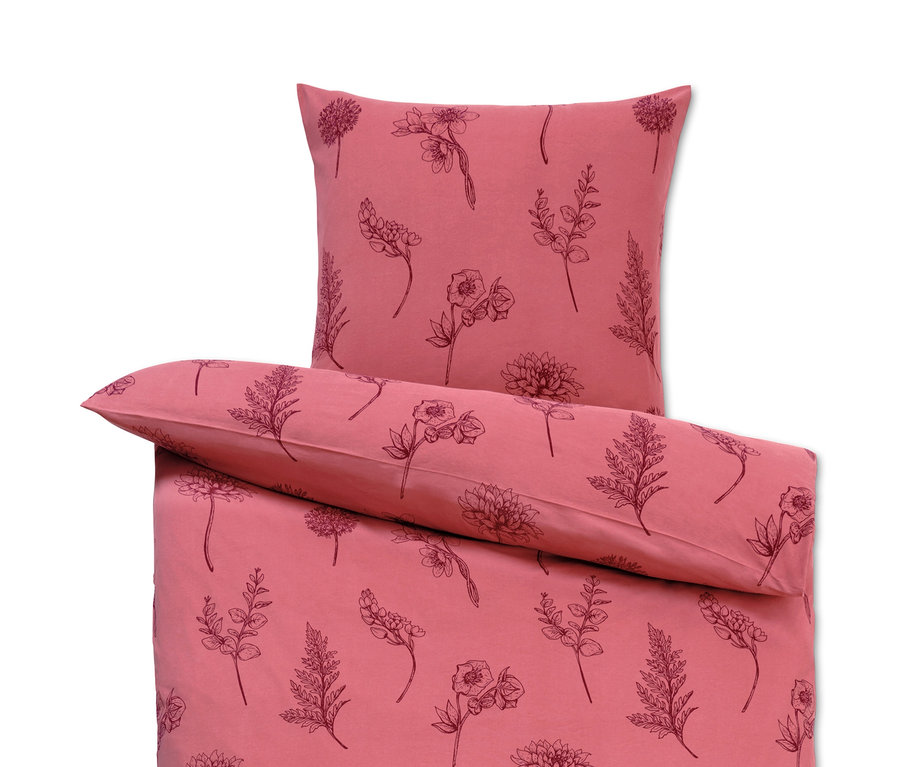Rosa Winterjersey-Bettwäsche mit Blumendruck.