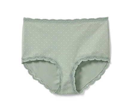 Eine grüne Highwaist-Panty mit weißen Tupfen und Spitze.