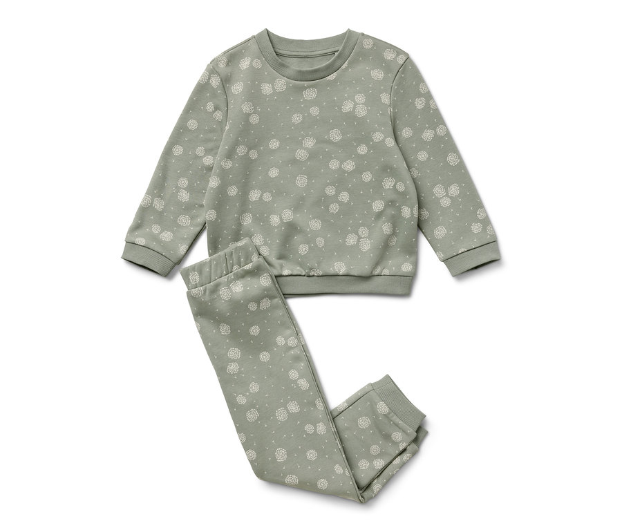 Ein grünes Sweat-Kombi mit weißen Blumen.