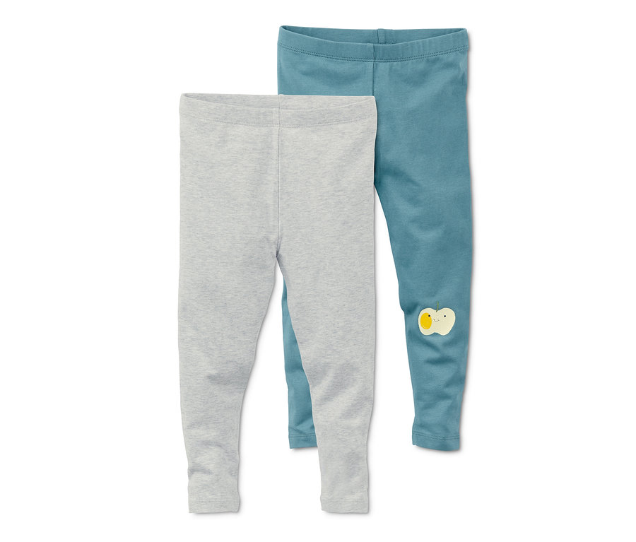 Zwei Leggings: eine graue und eine blaugrüne mit Apfel-Applikation.