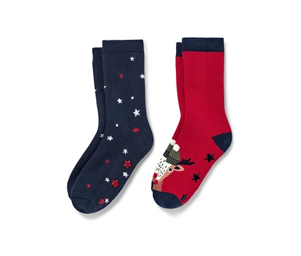 Zwei Paar Kleinkind-Antirutsch-Socken, Rentier. Ein Paar ist marineblau mit Sternen, das andere rot mit einem Rentier.