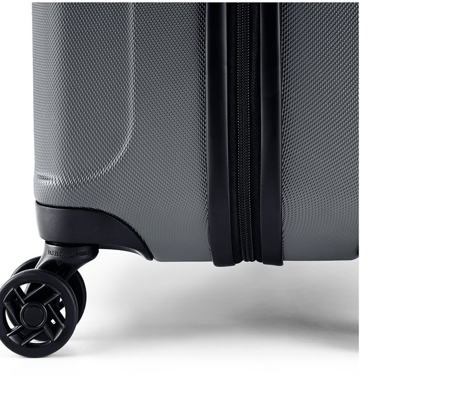 Detailansicht eines grauen, mittelgroßen Hartschalen Koffers aus dem Koffer-Set, mittel und groß.