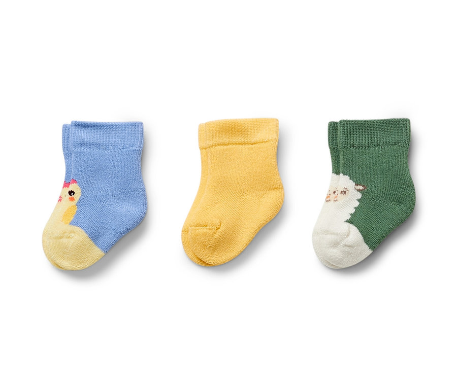 Drei Paar Frottier-Babysocken: hellblau mit Küken, gelb und grün mit Schaf.
