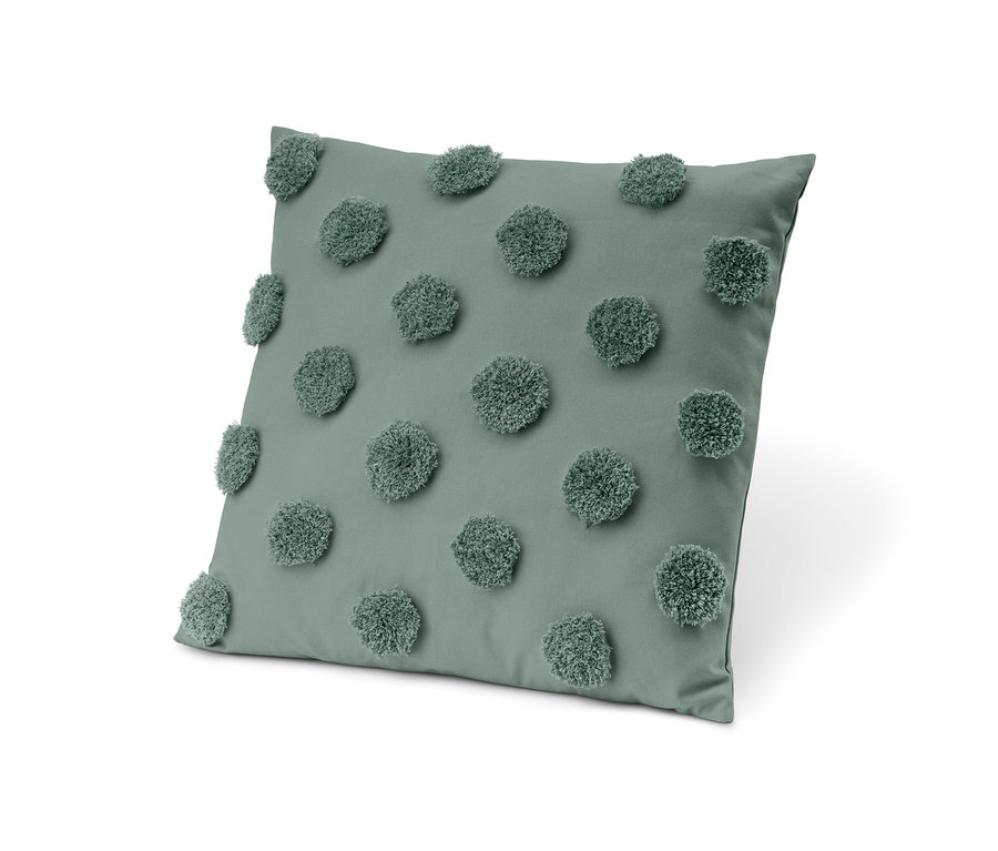 Grünes Dekokissen mit Füllung.