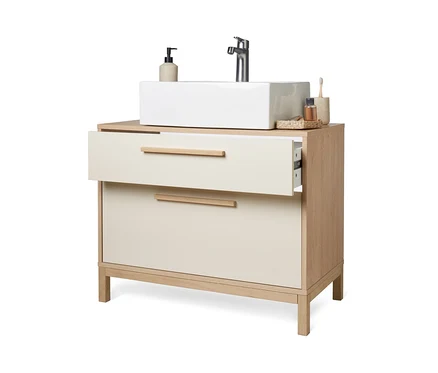 Ein Eklund Bad-Waschbeckenunterschrank in Vanille mit einer offenen Schublade.
