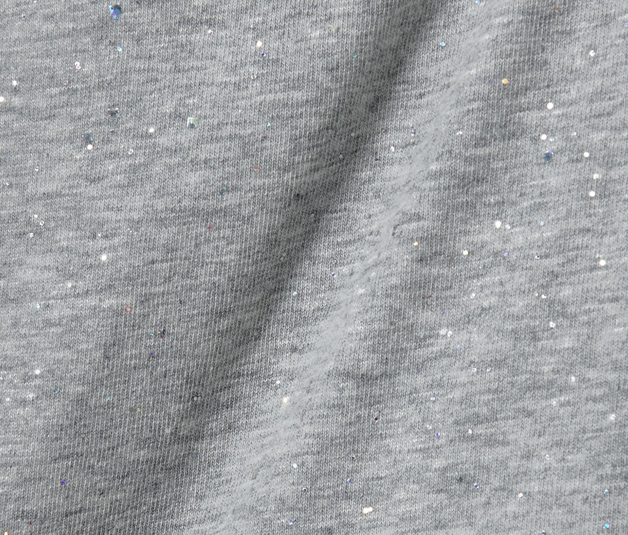 Detailaufnahme von 2 Kinder-Glitzer-Leggings.
