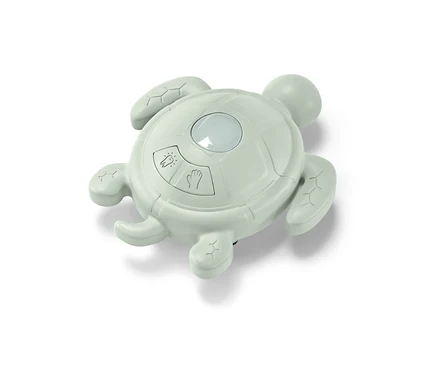 Ein grüner, schildkrötenförmiger Händewasch-und-Zahnputz-Timer.