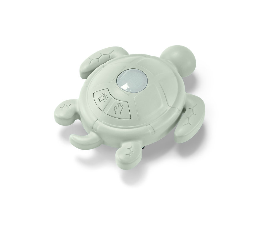 Ein grüner, schildkrötenförmiger Händewasch-und-Zahnputz-Timer.