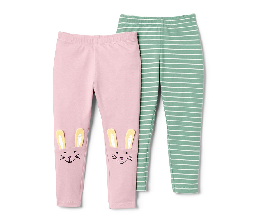 Zwei Kleinkinder-Leggings, eine rosa mit Hasenmuster, eine grün-weiss gestreift.