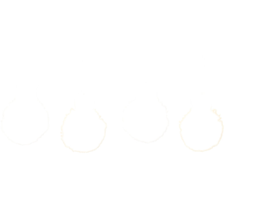 Vier Oster-Pompons aus dem Oster-Pompon-Bastel-Set.