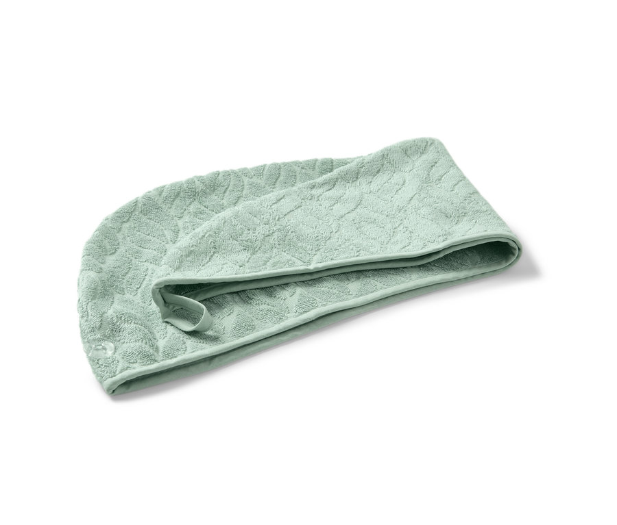 Ein Turban-Handtuch in Grün.