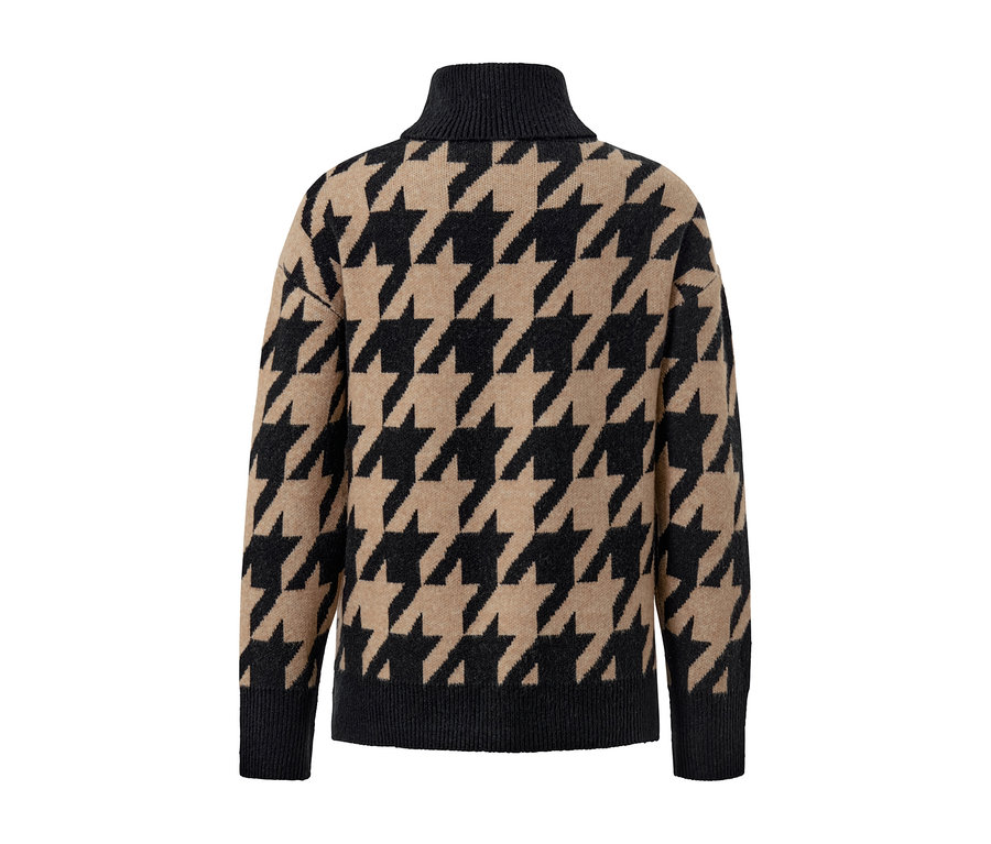 Detailansicht eines Strickpullovers mit Hahnentritt-Jacquard.