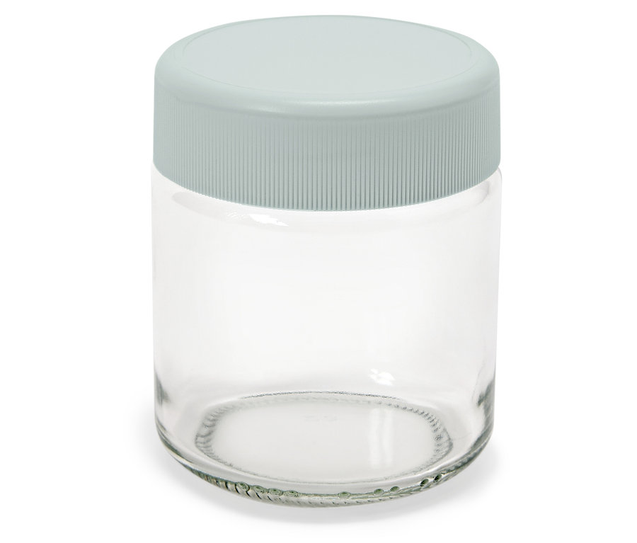 Leeres Glasgefäß mit grauem Deckel.