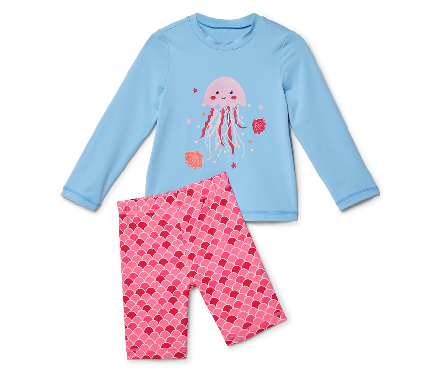 Ein hellblaues langärmliges Oberteil mit einer rosa Qualle und rosafarbenen Leggings mit Schuppenmuster.