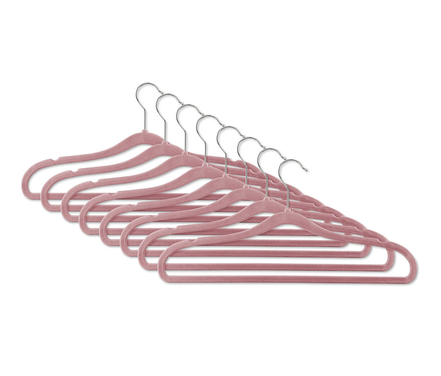Acht extraschmale Kleiderbügel in Rosa mit silbernen Haken liegen übereinander.