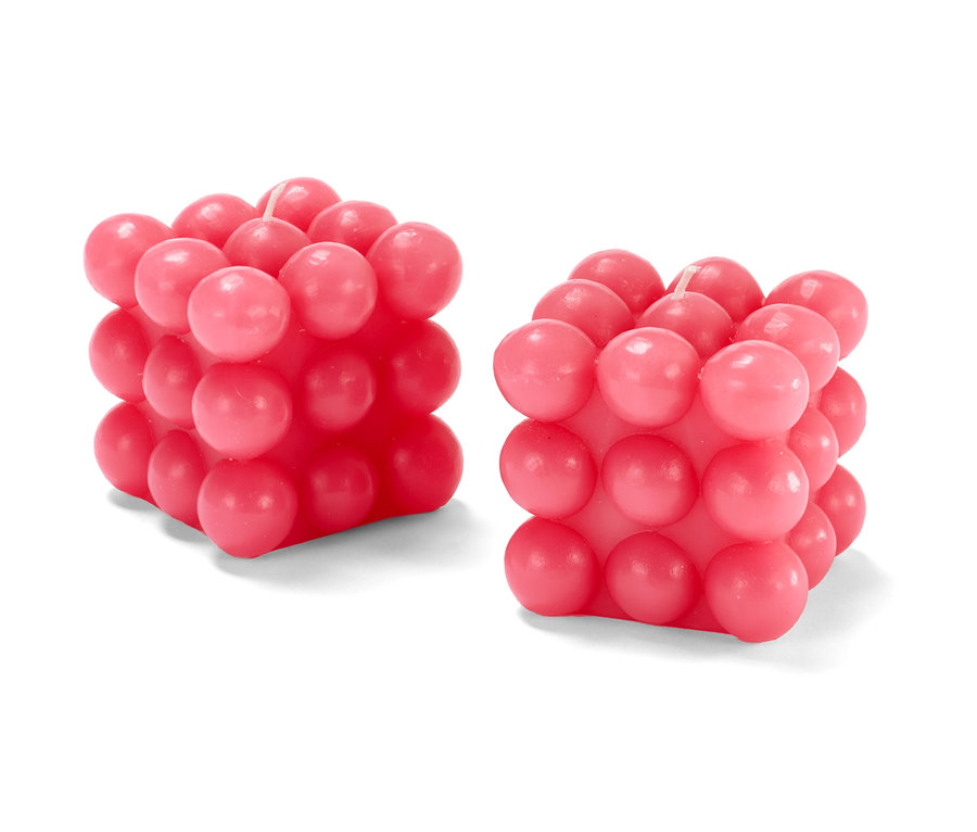 Zwei rosafarbene Bubble-Kerzen.