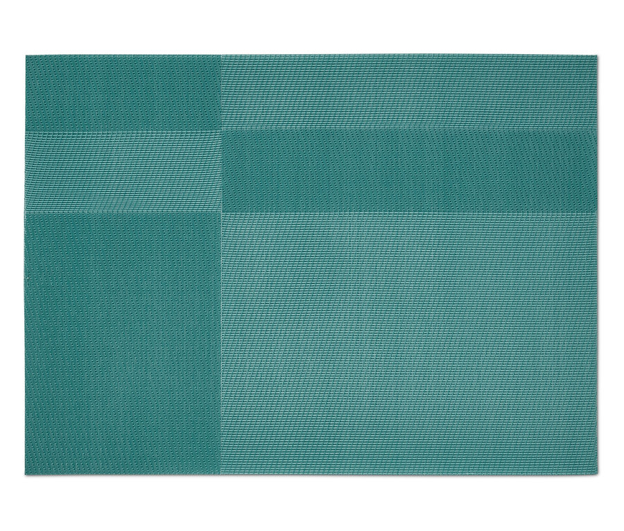 Ein grüner Tischset mit einem geometrischen Muster.