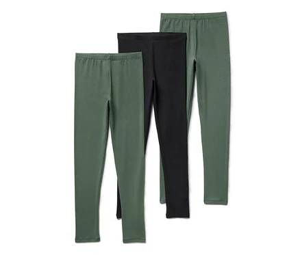 Drei Kinder-Leggings, eine schwarz, zwei grün.