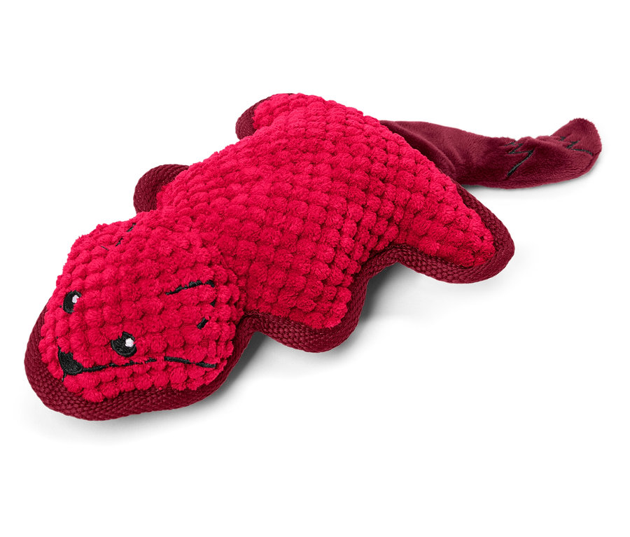 Ein rotes Plüschtier in Tierform liegt auf einem weißen Hintergrund.