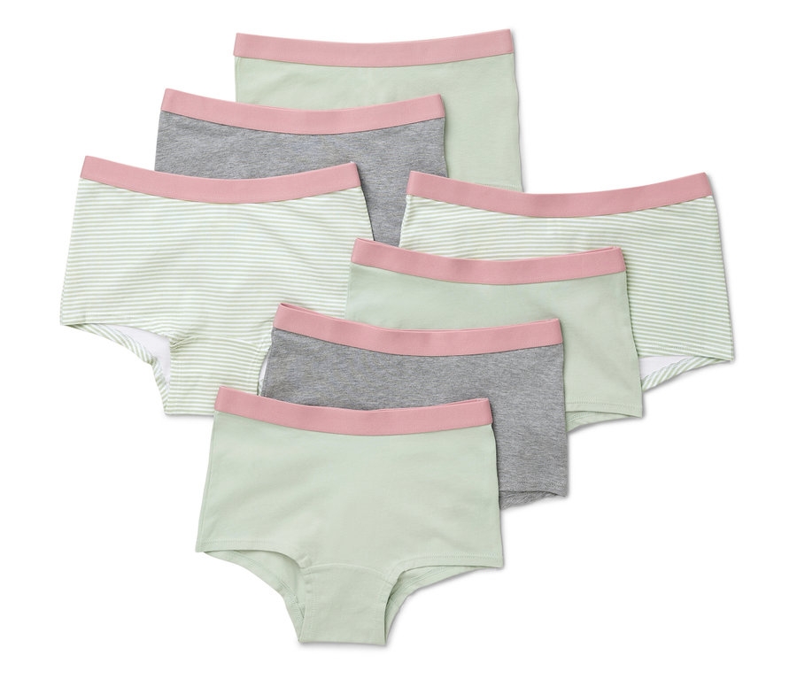 Sieben mintgrüne Mädchen-Pantys liegen übereinander.