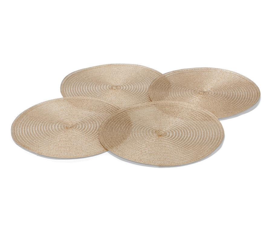 Vier goldfarbene, runde Platzsets.