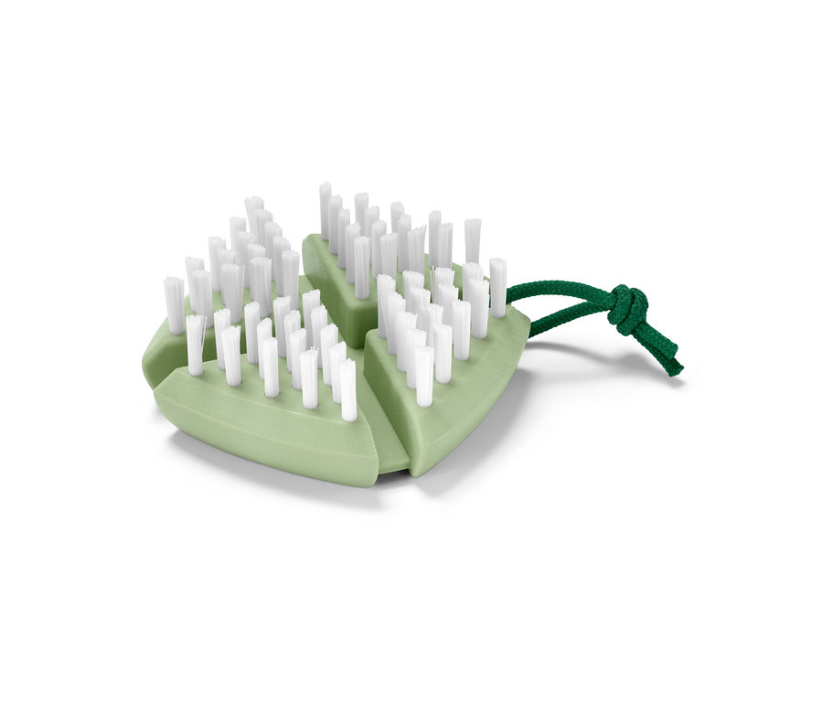 Eine flexible Gemüse-und-Obstbürste in Grün mit weißen Borsten und einer grünen Schnur.