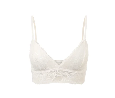 Weißes Spitzen-Bustier auf weißem Hintergrund.