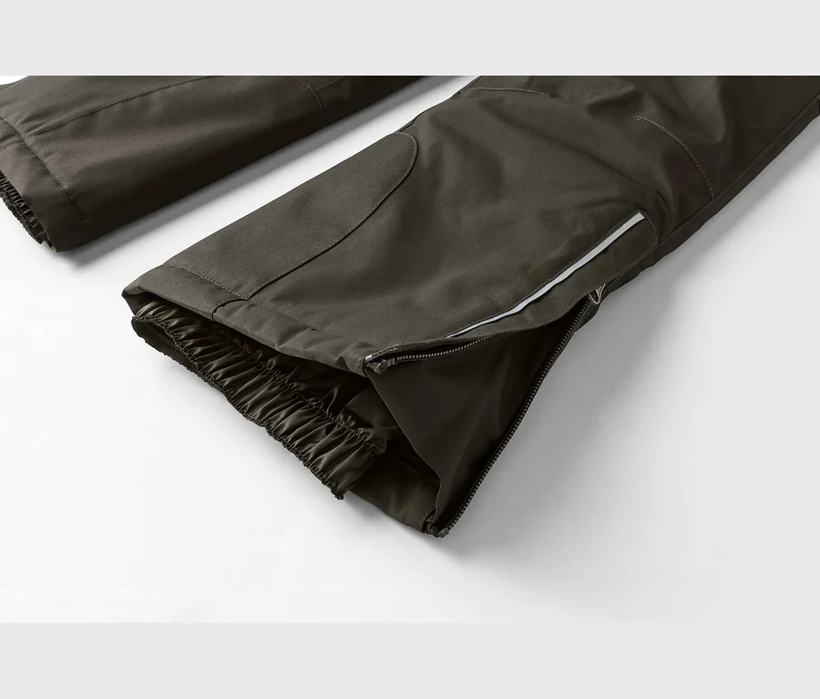 Dunkelgraue Funktionshosenbeine mit elastischen Bündchen und seitlichem Reißverschluss, der einen reflektierenden Streifen zeigt.