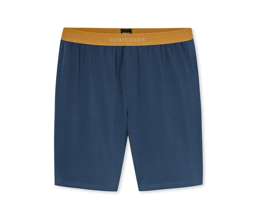 Blaue Shorts mit einem braunen Gummibund, auf dem „SCHIESSER“ in weißen Buchstaben steht.