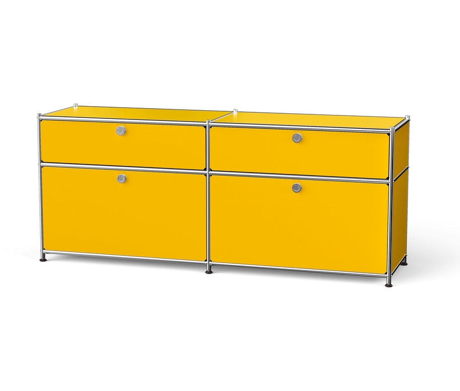 Gelber Schrank mit vier Schubladen und silbernem Rahmen.