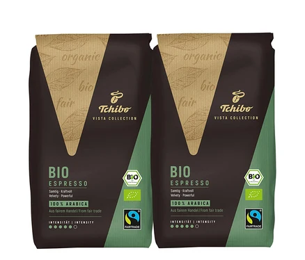 Zwei Packungen BIO Espresso Tchibo VISTA COLLECTION. Die Packungen sind braun und grün.
