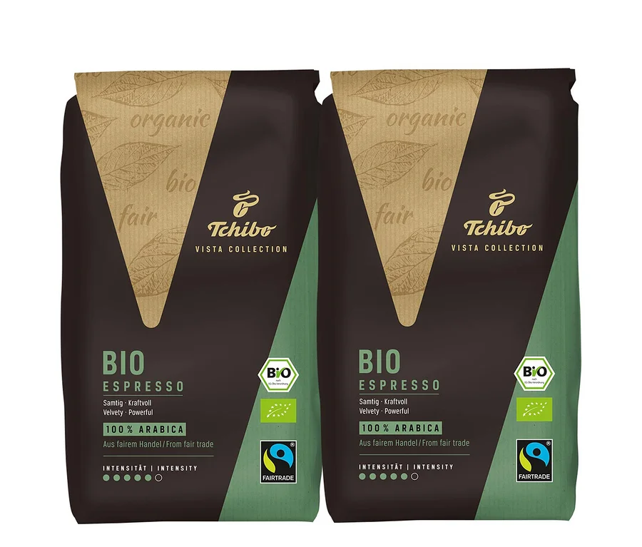 Zwei Packungen BIO Espresso Tchibo VISTA COLLECTION. Die Packungen sind braun und grün.