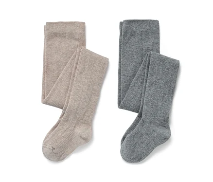 Zwei Paar Kinder-Strumpfhosen, einmal beige und einmal grau.