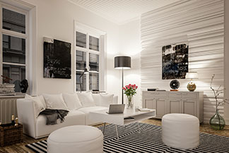 Hingucker Wohnzimmerlampe: Ein schwarz-weiss eingerichtetes Wohnzimmer mit einer weissen Couch, weissen, runden Sitzpolstern und einer Stehlampe mit schwarzem Schirm.